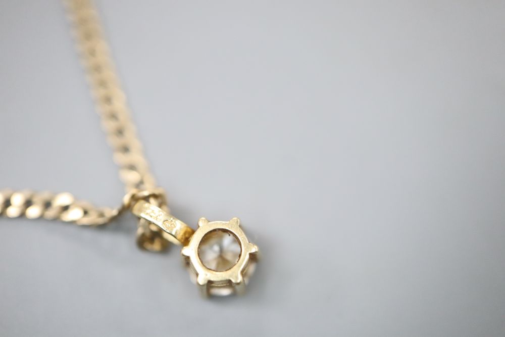 A modern 750 and solitaire diamond pendant, on a 9kt chain gold, pendant 8mm, chain 40cm.